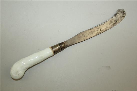 An early English porcelain white glazed moulded knife handle, 23cm